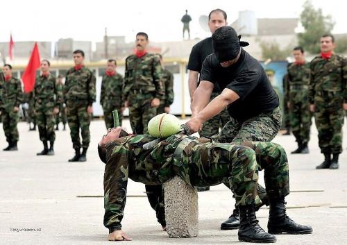  Blindfolded Kurdish security officer demonstrates 