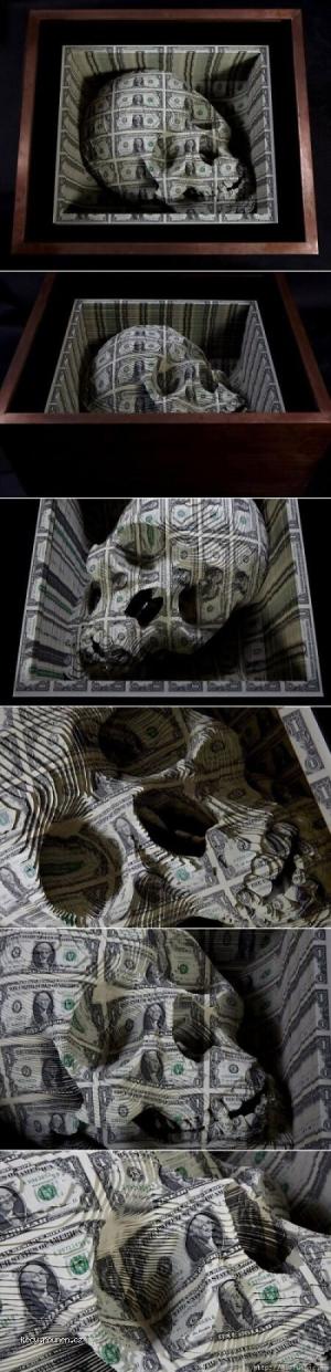 A skull carved from 1 dollar K in cash